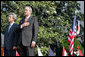 President George W. Bush and Prime Minister Junichiro Koizumi of Japan stand for the playing of the two countries' national anthems during the arrival ceremony on the South Lawn Thursday, June 29, 2006. White House photo by Shealah Craighead