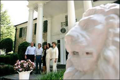 President George W. Bush, Laura Bush and Japanese Prime Minister Junichiro Koizumi are welcomed to Graceland, the home of Elvis Presley, by his former wife Priscilla Presley and their daughter Lisa-Marie Presley, Friday, June 30, 2006 in Memphis. White House photo by Eric Draper .