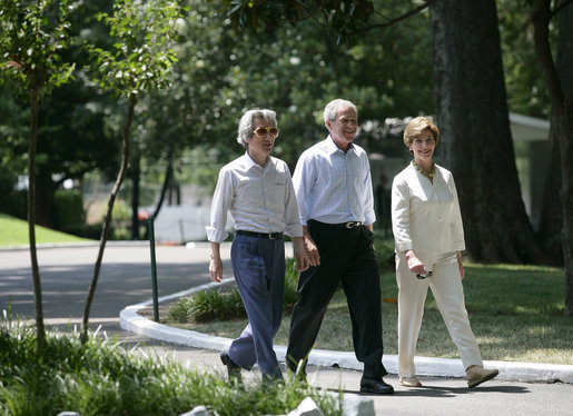 President George W. Bush, Laura Bush and Japanese Prime Minister Junichiro Koizumi, wearing a pair of Elvis-style sunglasses, tour the grounds of Graceland, the home of Elvis Presley, Friday, June 30, 2006 in Memphis. White House photo by Eric Draper