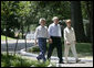 President George W. Bush, Laura Bush and Japanese Prime Minister Junichiro Koizumi, wearing a pair of Elvis-style sunglasses, tour the grounds of Graceland, the home of Elvis Presley, Friday, June 30, 2006 in Memphis. White House photo by Eric Draper