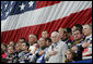 Vice President Dick Cheney joins NASCAR drivers during the playing of the National Anthem Saturday, July 1, 2006, prior to the start of the 2006 Pepsi 400 NASCAR race at Daytona International Speedway in Daytona, Fla. White House photo by David Bohrer