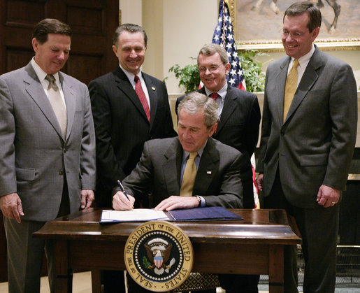 President George W. Bush is joined by U.S. Secretary of Health & Human Services Michael O. Leavitt, right, former Texas U.S. Representative Tom DeLay, left, U.S. Rep. Wally Herger, R-Calif., second from left and U.S. Sen. Mike DeWine, R-Ohio, in the Roosevelt Room of the White House, Monday, July 3, 2006, as President Bush signs H.R. 5403, the Safe and Timely Interstate Placement of Foster Children Act of 2006. White House photo by Kimberlee Hewitt