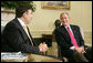 President George W. Bush and Georgian President Mikhail Saakashvili talk to the press in the Oval Office Wednesday, July 5, 2006. "He believes in the universality of freedom. He believes that democracy is the best way to yield the peace. The Georgian government and the people of Georgia have acted on those beliefs," said President Bush. "I want to thank you for your contribution in Iraq, to help the Iraqi people realize the great benefits of democracy." White House photo by Kimberlee Hewitt