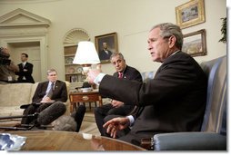 President George W. Bush and Zalmay Khalilzad, U.S. Ambassador to Iraq, meet with the press in the Oval Office Thursday, July 6, 2006. White House photo by Eric Draper