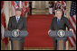 President George W. Bush and Canadian Prime Minister Stephen Harper hold a joint press conference in the East Room Thursday, July 6, 2006. "The President and I have agreed to task our officials to provide a more forward-looking approach focused on the environment, climate change, air quality and energy issues in which our governments can cooperate," said Prime Minister Harper. "We raised the issue of how regulatory cooperation could increase productivity, while helping to protect our health, safety, and environment." White House photo by Kimberlee Hewitt