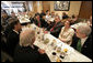 President George W. Bush meets local business leaders for breakfast at Lou Mitchell’s Restaurant in Chicago, Friday, July 7, 2006. White House photo by Eric Draper