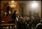 President George W. Bush, Mrs. Laura Bush and guests listen to the band Rascal Flatts in the East Room of the White House following a dinner honoring the Special Olympics and founder Eunice Kennedy Shriver, Monday, July 10, 2006. White House photo by Shealah Craighead