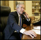 President George W. Bush speaks with crew members of the Space Shuttle Discovery during a telephone call from the Oval Office of the White House Tuesday, July 11, 2006. White House photo by Eric Draper