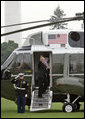  President George W. Bush and Laura Bush board Marine One en route to Germany and Russia on the South Lawn Wednesday, July 12, 2006. President Bush will meet with Chancellor Angela Merkel in Germany and attend the G8 Summit in St. Petersburg, Russia. White House photo by Kimberlee Hewitt