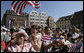People crowd the town square of Stralsund, Germany, as Chancellor Angela Merkel welcomes President George W. Bush and Laura Bush Thursday, July 13, 2006. "And in 1989, it was also one of the many cities where on Monday demonstrations took place, where people went out into the streets to demand freedom, to demonstrate for freedom," said Chancellor Merkel. White House photo by Eric Draper