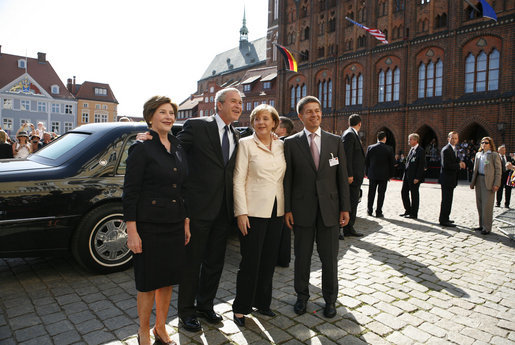 President George W. Bush and Laura Bush participate in an arrival ceremony with German Chancellor Angela Merkel and her husband Joachim Sauer in Stralsund, Germany, Thursday, July 13, 2006. White House photo by Paul Morse