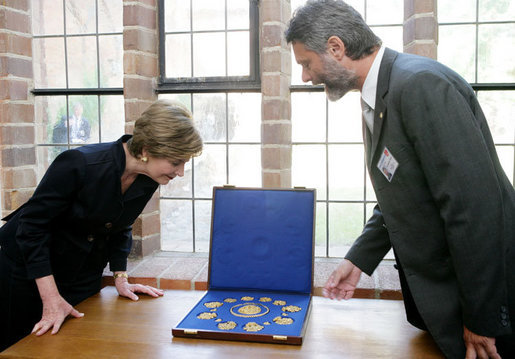 Mrs. Laura Bush is shown jewelry artifacts on her tour of the City of Stralsund Archives in Stralsund, Germany, Thursday, July 13, 2006, by Dr. Andreas Gruger, director of the Stralsund Museum of Cultural History. White House photo by Shealah Craighead