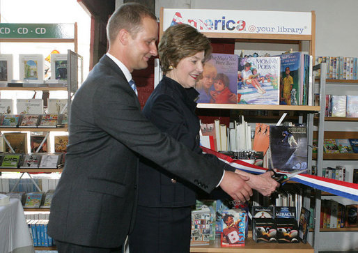 Mrs. Laura Bush participates in a ribbon cutting, assisted by Michael Gawenda, director of the City Library of Stralsund, Thursday, July 13, 2006, at the Stralsund Children’s Library in Stralsund, Germany, to open the exhibit America@yourlibrary. The America@yourlibrary is a new initiative to develop existing and new partnerships between German public libraries and the U.S. Emabssy and Consulate Resource Centers. White House photo by Shealah Craighead