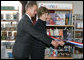 Mrs. Laura Bush participates in a ribbon cutting, assisted by Michael Gawenda, director of the City Library of Stralsund, Thursday, July 13, 2006, at the Stralsund Children’s Library in Stralsund, Germany, to open the exhibit America@yourlibrary. The America@yourlibrary is a new initiative to develop existing and new partnerships between German public libraries and the U.S. Emabssy and Consulate Resource Centers. White House photo by Shealah Craighead
