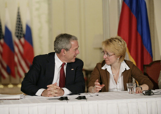 President George W. Bush talks with Irina Yasina , a representative of Open Russia, at a roundtable discussion with Civil Society at the Consul General’s residence, Friday, July 14, 2006 in St. Petersburg, Russia. White House photo by Eric Draper