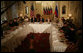 Participants join President George W. Bush Friday, July 14, 2006, at the Consul General's Residence in St. Petersburg, Russia, for a roundtable with the Civil Society organization. White House photo by Paul Morse