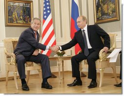 President George W. Bush and Russia's President Vladimir Putin shake hands before their G8 bilateral meeting Saturday, July 15, 2006, at the Konstantinovsky Palace Complex in Strelna, Russia.  White House photo by Eric Draper