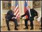 President George W. Bush and Russia's President Vladimir Putin shake hands before their G8 bilateral meeting Saturday, July 15, 2006, at the Konstantinovsky Palace Complex in Strelna, Russia. White House photo by Eric Draper