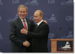President George W. Bush and President Vladimir Putin exchange handshakes Saturday, July 15, 2006, after a joint press availability at the International Media Center in the Konstantinovsky Palace Complex, site of the G8 Summit in Strelna, Russia. White House photo by Paul Morse