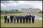 The G8 leaders pose of a photograph at Konstantinvosky Palace in Strelna, Russia, Sunday, July 16, 2006. From left, they are: Italian Prime Minister Romano Prodi; German Chancellor Angela Merkel; United Kingdom Prime Minister Tony Blair; French President Jacques Chirac; Russian President Vladimir Putin; President George W. Bush; Japanese Prime Minister Junichiro Koizumi; Canadian Prime Minister Stephen Harper; President of the European Union Prime Minister Matti Vanhanen of Finland, and European Commission President Jose Manuel Barroso.  White House photo by Paul Morse