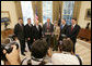 President George W. Bush poses for photos in the Oval Office of the White House Tuesday, July 18, 2006, with members of the National Capital Area Council of the Boy Scouts of America, from left to right, Jim Turley, Al Lambert, Bill Marriott Jr., CJ McWilliams, Jack Gerard and Bill Hagerty. White House photo by Eric Draper