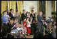 President George W. Bush delivers remarks about stem cell research policy legislation in the East Room Wednesday, July 19, 2006. "Each of these children was adopted while still an embryo, and has been blessed with the chance to grow up in a loving family," said the President of children sharing the stage with him. "These boys and girls are not spare parts. They remind us of what is lost when embryos are destroyed in the name of research." White House photo by Kimberlee Hewitt