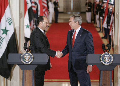 President George W. Bush shakes hands with Iraqi Prime Minister Nouri al-Maliki at the conclusion of their joint press availability in the East Room of the White House Tuesday, July 25, 2006. White House photo by Kimberlee Hewitt