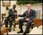 President George W. Bush welcomes Sudanese Liberation Movement leader Minni Minnawi to the Oval Office Tuesday, July 25, 2006, in Washington, D.C., meeting to discuss the Darfur region of western Sudan. White House photo by Kimberlee Hewitt