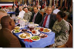 President George W. Bush and Iraqi Prime Minister Nouri al-Maliki share some conversation and lunch with military personnel Wednesday, July 26, 2006, at Fort Belvoir, Va. White House photo by Paul Morse