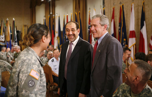 President George W. Bush and Iraqi Prime Minister Nouri al-Maliki meet with military personnel during their visit to Fort Belvoir, Va., Wednesday, July 26, 2006. White House photo by Paul Morse