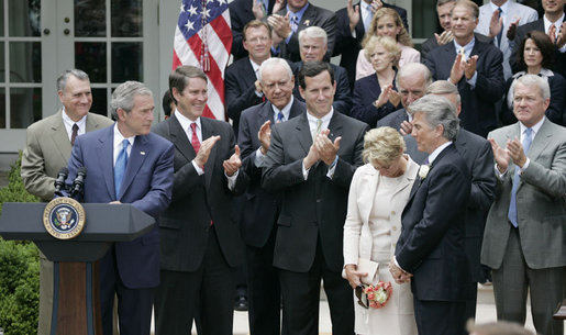 President George W. Bush, joined by Senate and House members, welcomes John and Reve Walsh prior to signing H.R. 4472, the Adam Walsh Child Protection and Safety Act of 2006 at a ceremony Thursday, July 27, 2006, in the Rose Garden at the White House. The bill is named for the Walsh’s six-year-old son Adam Walsh who was abducted and killed 25 years ago. White House photo by Paul Morse