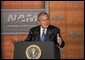 President George W. Bush gestures as he addresses the National Association of Manufacturers on the strength of the U.S. economy Thursday, July 27, 2006, at the Grand Hyatt hotel in Washington, D.C. White House photo by Paul Morse