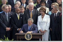 President George W. Bush signs H.R. 9, the Fannie Lou Hamer, Rosa Parks, and Coretta Scott King Voting Rights Act Reauthorization and Amendments Act of 2006, on the South Lawn Thursday, July 27, 2006.  White House photo by Paul Morse