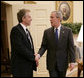 President George W. Bush welcomes Prime Minister Tony Blair of the United Kingdom back to the White House where the two leaders met for private discussions and later held a joint press availability Friday, July 28, 2006, in the East Room of the White House. White House photo by Eric Draper