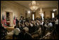 President George W. Bush is joined by Prime Minister Tony Blair of the United Kingdom as he answers a reporter’s question during a joint press availability Friday, July 28, 2006, in the East Room of the White House. White House photo by Eric Draper