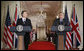 President George W. Bush is joined by Prime Minister Tony Blair of the United Kingdom as he answers a reporter’s question during a joint press availability Friday, July 28, 2006, in the East Room of the White House. White House photo by Paul Morse