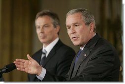 President George W. Bush gestures as he answers a reporter’s question during a joint press availability with Prime Minister Tony Blair of the United Kingdom Friday, July 28, 2006, in the East Room of the White House. White House photo by Paul Morse
