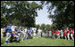 President George W. Bush welcomes players and guests to the White House Sunday, July 30, 2006, for the Tee Ball on the South Lawn game between the Thurmont Little League Civitan Club of Frederick Challengers of Thurmont, Md., and the Shady Spring Little League Challenger Braves of Shady Spring, W. Va. White House photo by Paul Morse