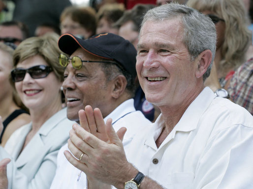 President George W. Bush and Laura Bush are joined by baseball legend and hall of famer Willie Mays, Tee Ball Commissioner for the day Sunday, July 30, 2006, at the Tee Ball on the South Lawn game between the Thurmont Little League Civitan Club of Frederick Challengers of Thurmont, Md., and the Shady Spring Little League Challenger Braves of Shady Spring, W. Va. White House photo by Paul Morse