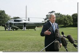 President George W. Bush addresses reporters on the South Lawn of the White House Sunday, July 30, 2006, saying America will work together with members of the United Nations Security Council to develop a solution that will bring a sustainable peace to the conflict in Lebanon. White House photo by Paul Morse