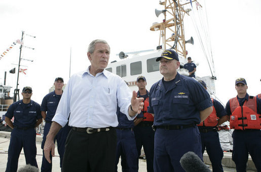 President George W. Bush stands with Admiral Thad Allen, Commandant of the U.S. Coast Guard, as he talks with reporters following his tour of the U.S. Coast Guard Integrated Support Command at the Port of Miami Monday, July 31, 2006. White House photo by Kimberlee Hewitt