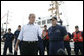 President George W. Bush stands with Admiral Thad Allen, Commandant of the U.S. Coast Guard, as he talks with reporters following his tour of the U.S. Coast Guard Integrated Support Command at the Port of Miami Monday, July 31, 2006. White House photo by Kimberlee Hewitt