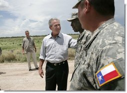 President George W. Bush speaks with members of the National Guard on duty along the U.S.-Mexico border during his visit Thursday, Aug. 3, 2006, in the Rio Grande Valley border patrol sector in Mission, Texas.  White House photo by Eric Draper