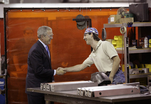 President George W. Bush speaks with a metal worker Thursday, Aug. 10, 2006, during his tour and visit with employees at Fox Valley Metal-Tech in Green Bay, Wis. White House photo by Eric Draper