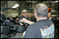 President George W. Bush meets workers along the assembly line during a tour of the Harley-Davidson Vehicle Operations facility Wednesday, Aug. 16, 2006 in York, Pa., where he participated in a roundtable discussion on the economy. White House photo by Kimberlee Hewitt