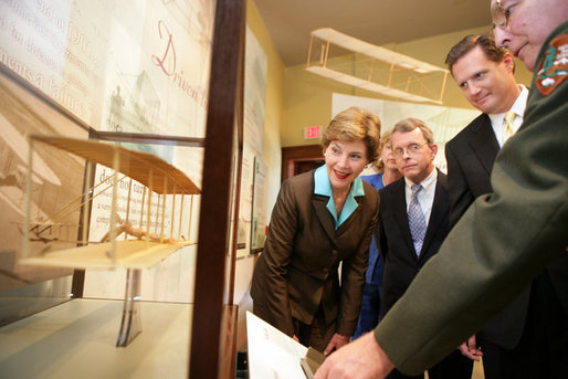 Mrs. Laura Bush, U.S. Senator Mike DeWine, and U.S. Rep. Mike Turner listen to National Park Superintendent Larry Blake as he shows them a model of the Wright Brothers airplane during a tour of the Dayton Aviation Heritage National Historical Park in the Wright-Dunbar Village, a Preserve America neighborhood, in Dayton, Ohio, Wednesday, August 16, 2006. Also shown is Fran DeWine, wife of Sen. Mike DeWine. White House photo by Shealah Craighead
