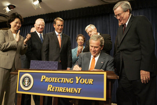 President George W. Bush signs into law H.R. 4, the Pension Protection Act of 2006, Thursday, Aug. 17, 2006. Joining him onstage in the Eisenhower Executive Office Building are, from left: Secretary of Labor Elaine Chao; Rep. Buck McKeon of California; Rep. John Boehner of Ohio; Senator Blanche Lincoln, D-Ark.; Senator Michael Enzi, R-Wyo., and Rep. Bill Thomas of California. Said the President, "Americans who spend a lifetime working hard should be confident that their pensions will be there when they retire." White House photo by Kimberlee Hewitt