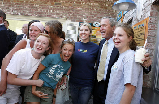 President George W. Bush poses for photos with customers during an unscheduled stop Tuesday, Aug. 22, 2006, to enjoy some vanilla custard at Glaciers Custard and Coffee Cafe in Wayzata, Minn. President Bush earlier had participated in a health care panel discussion in Minnetonka, Minn. White House photo by Paul Morse