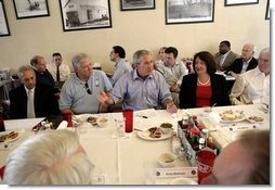 President George W. Bush is joined by Mississippi Governor Haley Barbour, left, as they attend a working luncheon with Mississippi community and housing officials at the Biloxi Schooner Restaurant to discuss the state’s recovery and rebuilding efforts Monday, Aug. 28, 2006 in Biloxi, Miss., on the one-year anniversary of Hurricane Katrina.  White House photo by Eric Draper