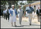 Mrs. Laura Bush meets with Biloxi, Miss., residents Sandy Patterson, left, and her husband, Thomas “Lynn” Patterson Monday, Aug. 28, 2006, during a walking tour in the same Biloxi neighborhood President George W. Bush visited following Hurricane Katrina in September 2005. The tour allowed President Bush the opportunity to assess the progress of the area’s recovery and rebuilding efforts a year after the devastating hurricane. White House photo by Eric Draper